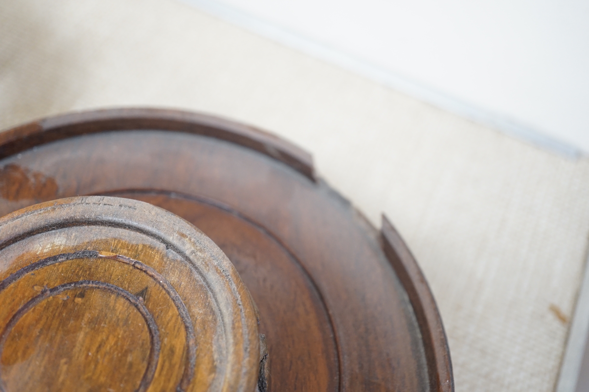 Seventeen Chinese carved wood stands of varying sizes, largest 30cm diameter